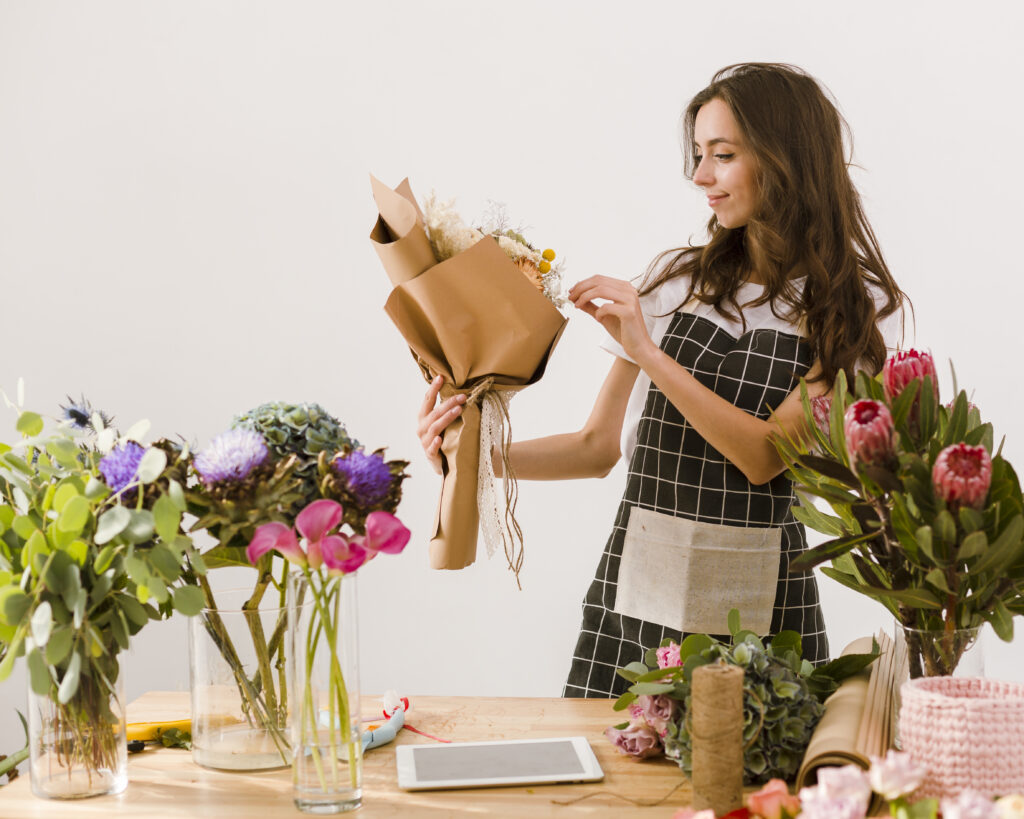 medium shot florist making beautiful bouquet